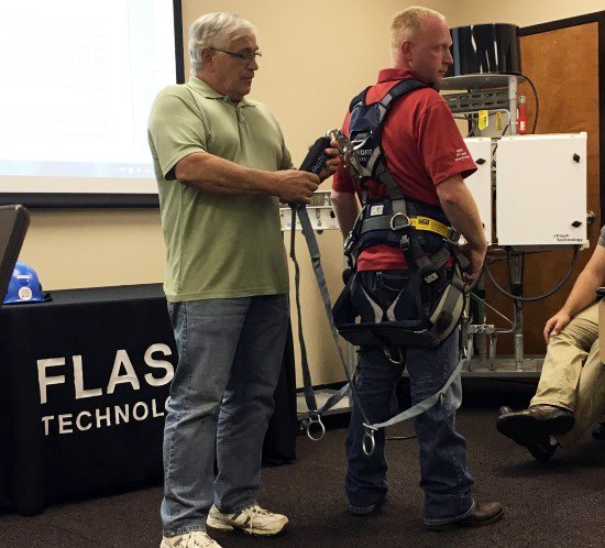 Safety Stand Down tower climber safety harness demonstration