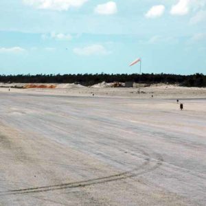 Duncan Town Airport Bahamas A704 runway threshold lights and aviation windsock at Duncan Town Airport in the Bahamas