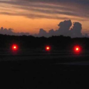 Red runway lights at Farmer's Cay Airport in the Bahamas