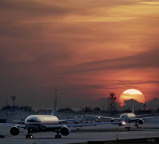planes and runway lights at Miami International Airport