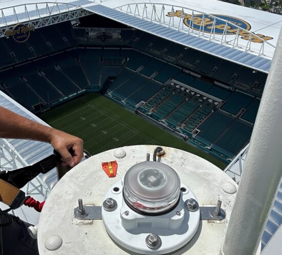 Red obstruction tower light. Top view of the Miami Dolphins Hard Rock stadium.